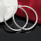 Sleek 5cm sterling silver circle hoops for women, combining simplicity and elegance in a versatile accessory.