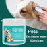Hand using pet ear cleaning wipe on small dog’s ear for hygiene care.