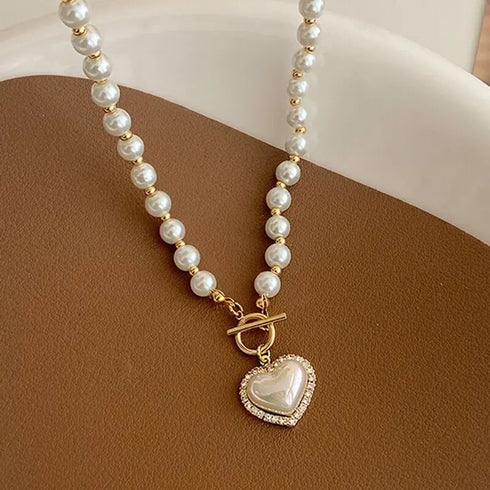 Luxury Korean pearl necklace with heart pendant on fine gold chain.