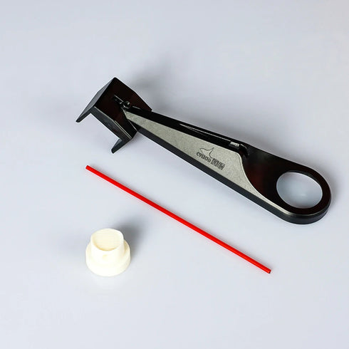 Motorcycle chain oiler tool with dual-sided nozzle for clean wax and lube application.