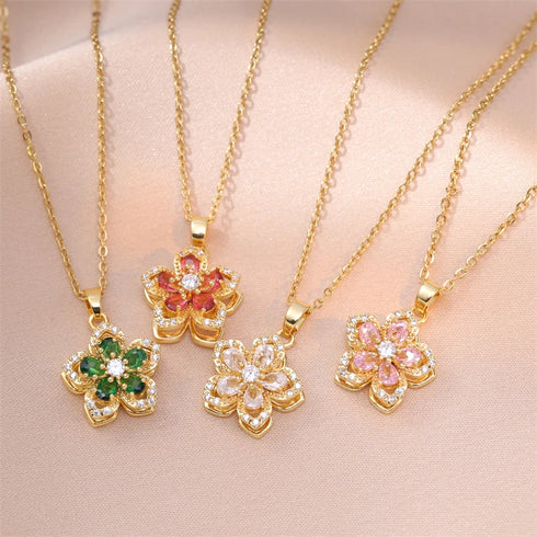 Close-up of gold flower necklace with sparkling zircon stones and rotatable feature.