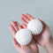 "Reusable laundry ball that prevents fabric twisting during washing.