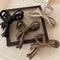 Sleek vintage-style matte bow hair clip for women, ideal for holding hair in a stylish updo or ponytail.
